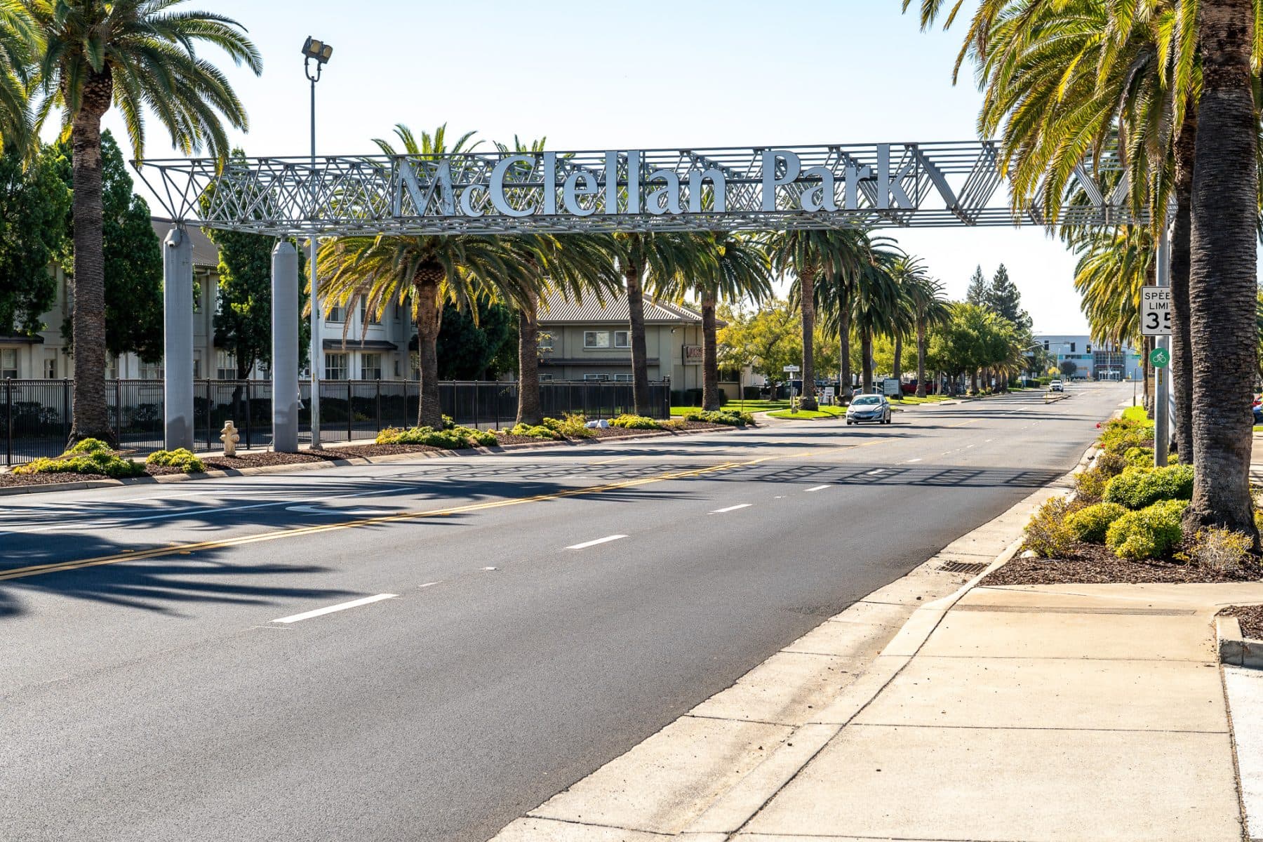 The McClellan Park entrance arch, lined with palms