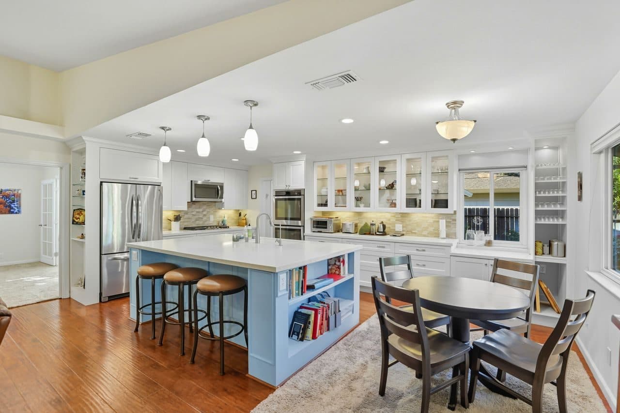 A bright white kitchen with an island