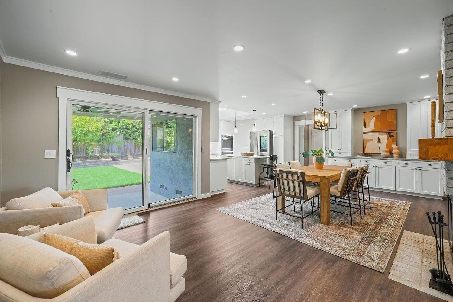 An open living and dining room looking out to the backyard